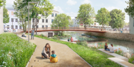 Architectural rendering of a lively urban riverfront park and footbridge. 